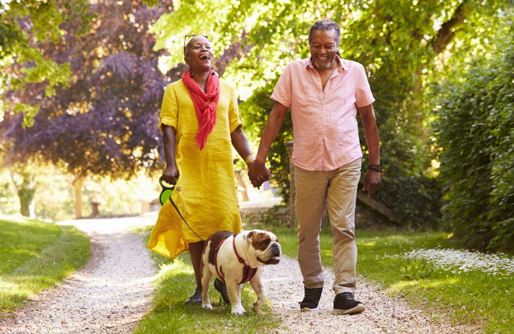 Couple walking dog